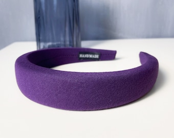 May include: Purple fabric headband with the text "BAGMAKE" printed on the inside.