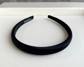 May include: A black velvet headband with the word "HANDMADE" printed on it.