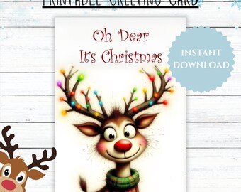 May include: A printable Christmas greeting card featuring a cartoon reindeer with colorful lights on its antlers. The card reads "Oh Dear It's Christmas" and includes a green and red plaid scarf. The words "Instant Download" are also visible.