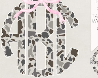 May include: A set of 79 high-resolution PNG files featuring a grey camo monogram with a scalloped border and a pink bow. The files are 300 DPI and have a transparent background.  The text "GREY CAMO" is at the top of the image.  The text "79 HIGH RES PNG FILES 300 DPI TRANSPARENT BACKGROUND SCALLOP BORDER DIGITAL DOWNLOAD PNG NO CROPPING FULL ALPHA" is at the bottom of the image.