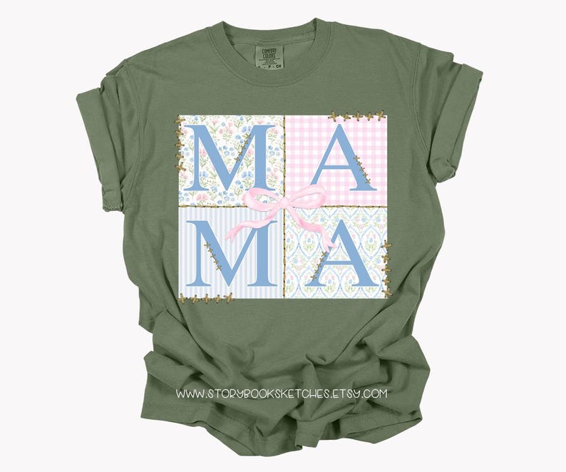 May include: A green t-shirt with a patchwork design featuring the word "MAMA" in blue letters with a pink bow. The design is surrounded by a gold glitter outline.