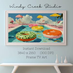 May include: A framed digital art print titled "Windy Creek Studio" depicts a pool scene with colorful inflatable rings. The artwork features a blue sky, white clouds, and pink and blue pool surroundings. The image includes the text "Instant Download 3840 x 2160 (300 DPI) Frame TV Art."