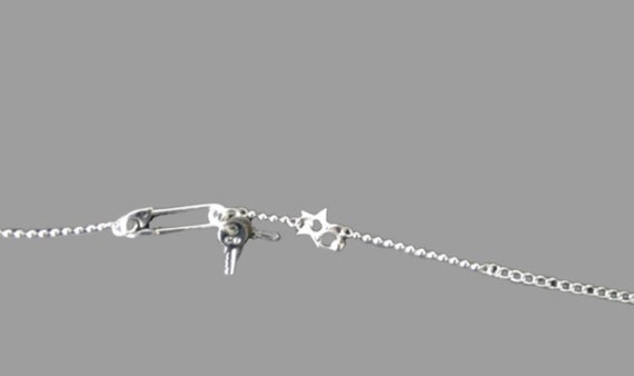 DIOR Silver Hardcore Punk Piercing Star Bracelet
