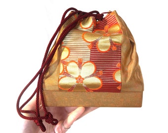 Elegant Japanese drawstring bag kinchaku - golden with floral accent