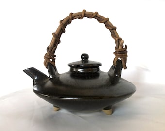 Elegant Japanese teapot with a wicker handle
