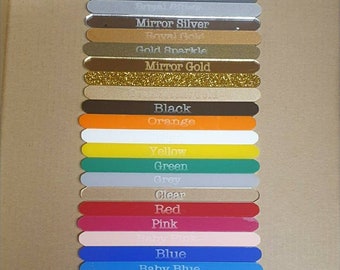 May include: A collection of 18 acrylic sticks in various colours, including silver sparkle, mirror silver, royal gold, gold sparkle, mirror gold, black, orange, yellow, green, grey, clear, red, pink, baby pink, blue, baby blue, purple, and brown. Each stick has a colour name printed on it.