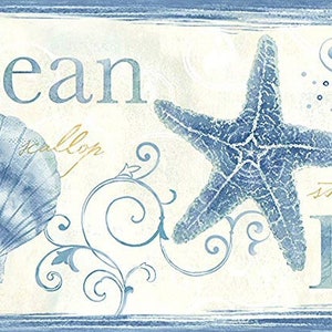 May include: Coastal-themed artwork featuring a blue starfish and a scallop shell. The word "Ocean" is at the top, and "Beach" is at the bottom. Decorative swirls and a blue border frame the design, evoking a seaside ambiance.