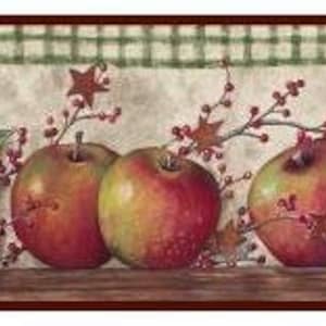 May include: A red and green apple border with a checkered pattern background. The apples are arranged in a row with leaves and berries.