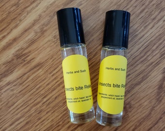 May include: Two yellow roll-on bottles with black caps. The labels read "Herbs and Such" and "Insects bite Relief". The ingredients are listed as witch hazel, tea tree oil, peppermint oil, and lavender oil.