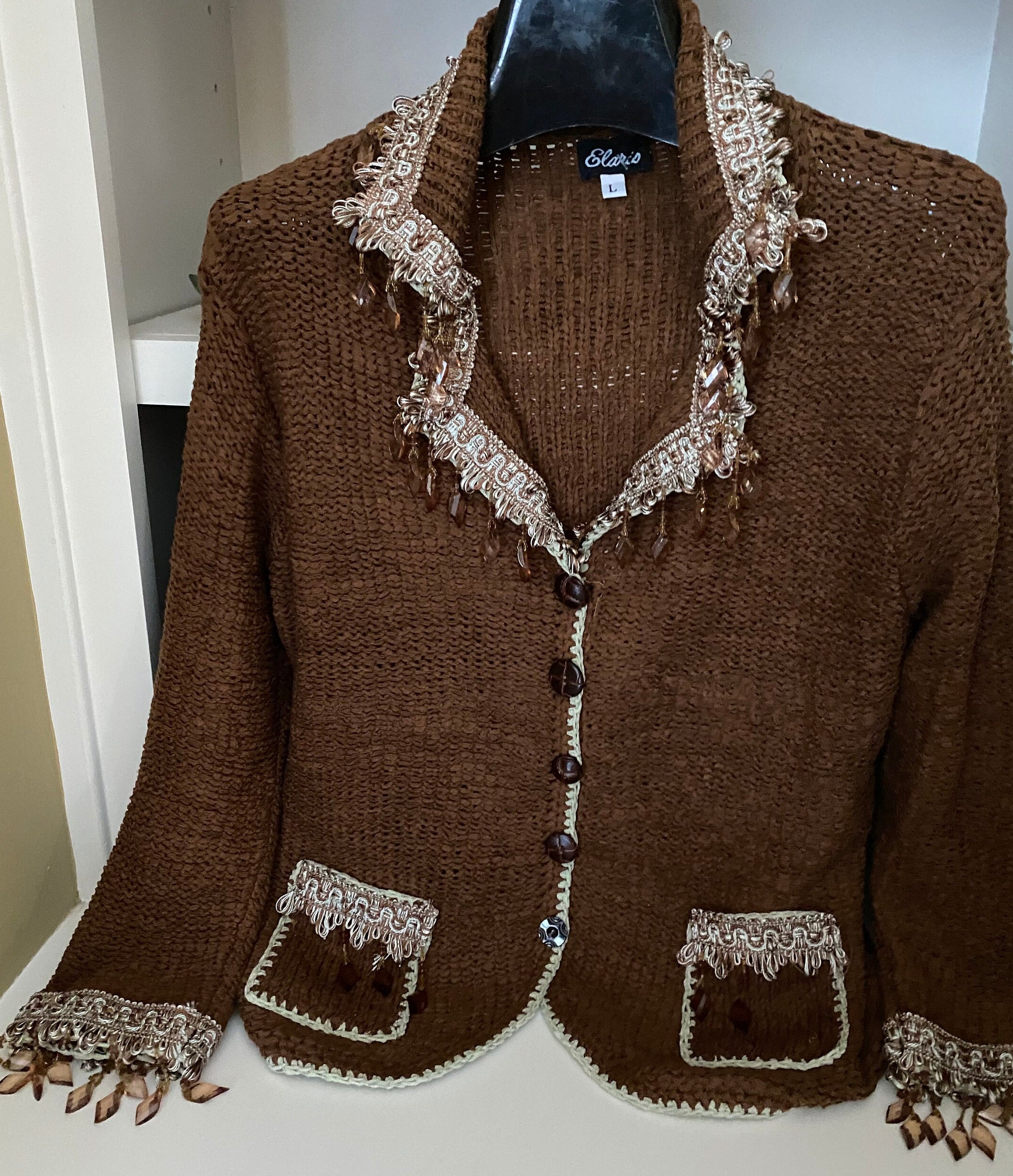 Designer Elaris cardigan Sweater in moca with lace trim colar at the neck and pockets very rare never worn size Large