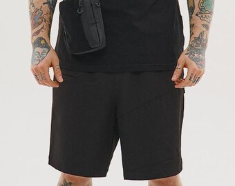 Techwear gorpcore cargo shorts, urban ninja tactical outfit, alternative samurai legwear