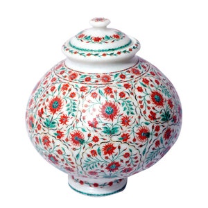 May include: White marble decorative jar with a lid, featuring intricate floral patterns in red, green, and gold.