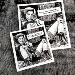 May include: Two black and white stickers with the text "do you ever fantasize... about being killed?" and a person in a black and white image. The person is sitting on a bench with their legs crossed.