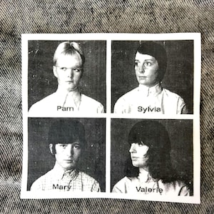 May include: A black and white print showing four portraits of women, each in a separate frame. The names "Pam", "Sylvia", "Mary", and "Valerie" are printed below each portrait. The image is set against a denim background.