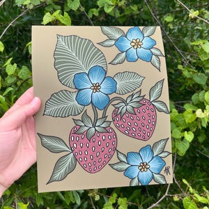 May include: A botanical illustration featuring blue flowers and pink strawberries on a tan background. The artwork includes detailed leaves and a stylized design, perfect for wall art or home decor.