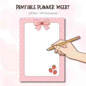 May include: A printable planner insert with a pink background adorned with white hearts. The design features a pink bow with a strawberry, three strawberries, and the text "PRINTABLE PLANNER INSERT (A5 Size - PDF Download)". A hand is holding a pencil.