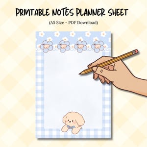 May include: Printable notes planner sheet with a blue gingham border and floral accents. The sheet features a cartoon dog illustration and the text "PRINTABLE NOTES PLANNER SHEET (A5 Size - PDF Download)". A hand holds a pencil over the blank page.