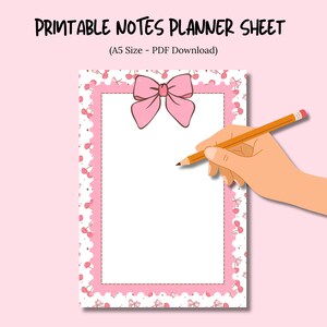 May include: A printable notes planner sheet with a pink bow and cherry border. The text "PRINTABLE NOTES PLANNER SHEET" is at the top. A hand is holding a pencil, ready to write on the blank white space. The planner is A5 size.
