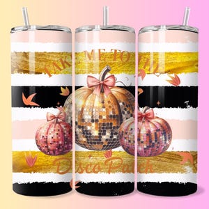 May include: A stainless steel tumbler with a straw features a design with gold, black, white, and pink stripes. The tumbler has three disco ball pumpkins with bows and the text "Take Me To The Disco Party."