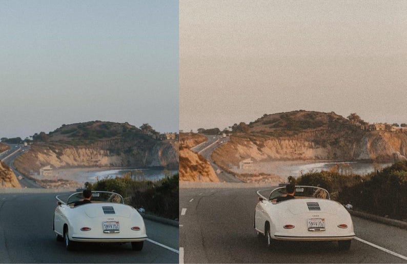 May include: A white vintage car driving on a winding road with a view of a beach and cliffs in the distance.