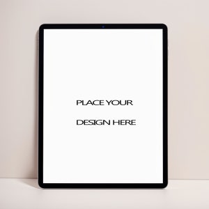 May include: A black tablet computer with a white screen that says "PLACE YOUR DESIGN HERE".