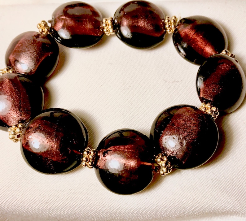 The wave of mid century in all its charms See Purple lovers unite in enjoying this beautiful vintage carbochon with see through stones