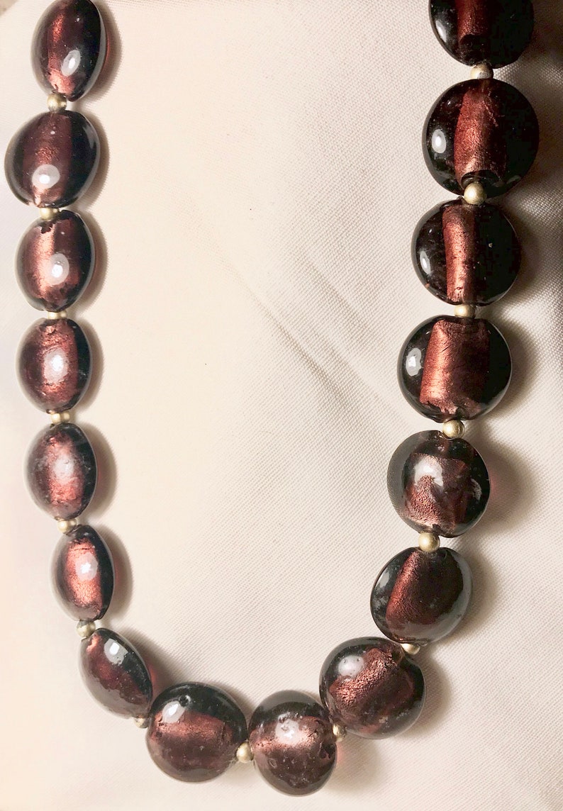 The wave of mid century in all its charms See Purple lovers unite in enjoying this beautiful vintage carbochon with see through stones