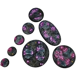 May include: A set of 8 round and oval-shaped miniature gaming bases with a dark gray and black background and pink accents. The bases are made of a textured material and have a variety of sizes.