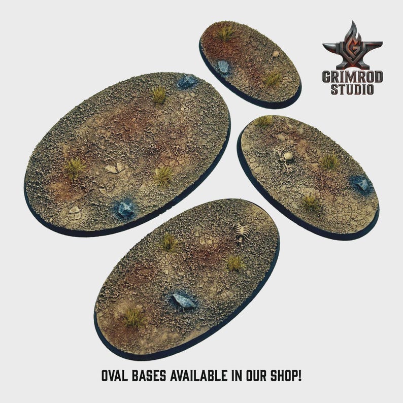 May include: Four oval-shaped bases with a textured, desert-like appearance. The bases feature a mix of brown, tan, and green tones, with small rocks and sparse vegetation. The text "OVAL BASES AVAILABLE IN OUR SHOP!" is at the bottom.