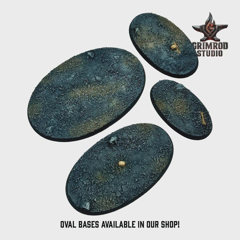 May include: Four oval-shaped bases with textured surfaces in shades of blue, gray, and brown. The bases have a rough, rocky appearance. The text "OVAL BASES AVAILABLE IN OUR SHOP!" is at the bottom. The Grimrod Studio logo is in the upper right.