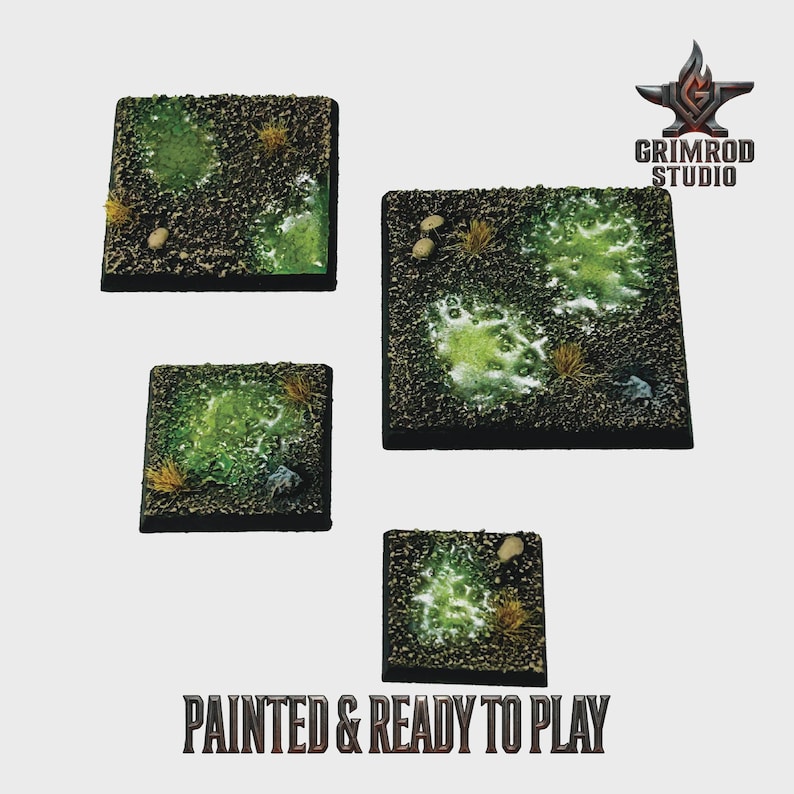 May include: Four square miniature bases with textured surfaces, featuring green and brown terrain with patches of grass and small rocks. The bases are painted and ready to play, as indicated by the text at the bottom of the image.
