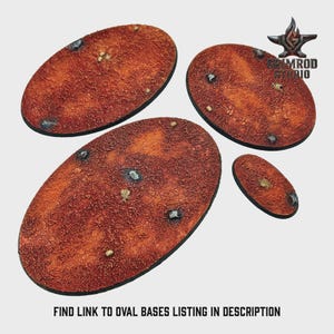 May include: Four oval-shaped bases with a textured, reddish-brown surface. Small rocks and lighter-colored details are scattered across the bases. The bases vary in size, with a small one in the foreground. The text "FIND LINK TO OVAL BASES LISTING IN DESCRIPTION" is at the bottom.