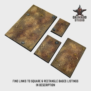 May include: Four textured, rectangular bases with a desert-like appearance. The bases are various sizes and feature a cracked, brown surface with small rocks and sparse vegetation. The Grimrod Studio logo is in the upper right corner. Text at the bottom reads: FIND LINKS TO SQUARE & RECTANGLE BASES LISTINGS IN DESCRIPTION.