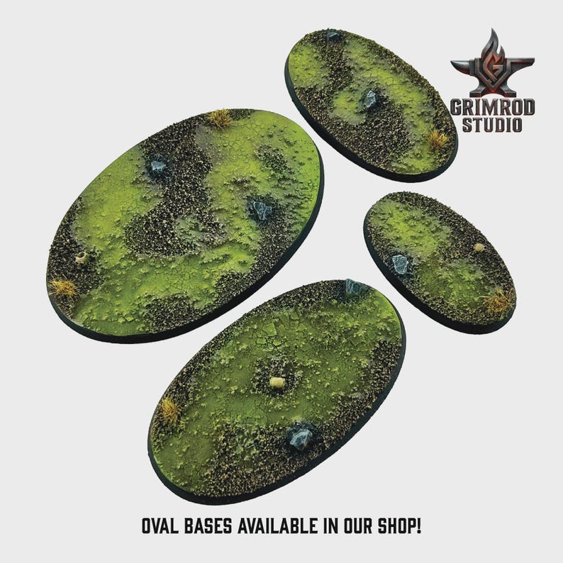 May include: Four oval bases with a textured, grassy terrain. The bases feature a mix of green, brown, and tan colors, with small rocks and patches of vegetation. The text "OVAL BASES AVAILABLE IN OUR SHOP!" is at the bottom.