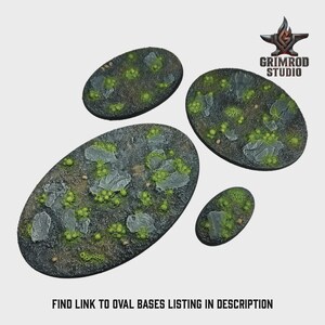 May include: Four oval-shaped miniature bases with a textured, rocky surface and patches of green vegetation. The bases vary in size, with the largest measuring approximately 4 inches in length. The Grimrod Studio logo is in the upper right corner. Text at the bottom reads: FIND LINK TO OVAL BASES LISTING IN DESCRIPTION.