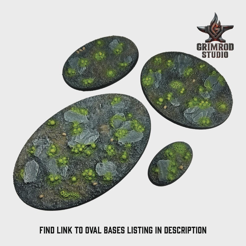 May include: Four oval-shaped miniature bases with a textured, rocky surface and patches of green vegetation. The bases vary in size, with the largest measuring approximately 4 inches in length. The Grimrod Studio logo is in the upper right corner. Text at the bottom reads: FIND LINK TO OVAL BASES LISTING IN DESCRIPTION.