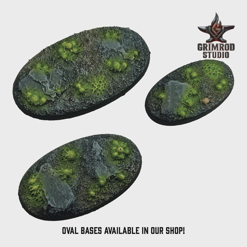 May include: Three oval-shaped miniature bases with textured surfaces. The bases feature a mix of gray, green, and brown tones, with simulated rock and vegetation. The text "OVAL BASES AVAILABLE IN OUR SHOP!" is at the bottom. The Grimrod Studio logo is in the top right.