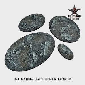 May include: Four oval-shaped miniature bases with textured surfaces, ideal for tabletop gaming. The bases are primarily dark gray with lighter gray and white accents, resembling a rocky terrain. The image includes the text: "FIND LINK TO OVAL BASES LISTING IN DESCRIPTION."