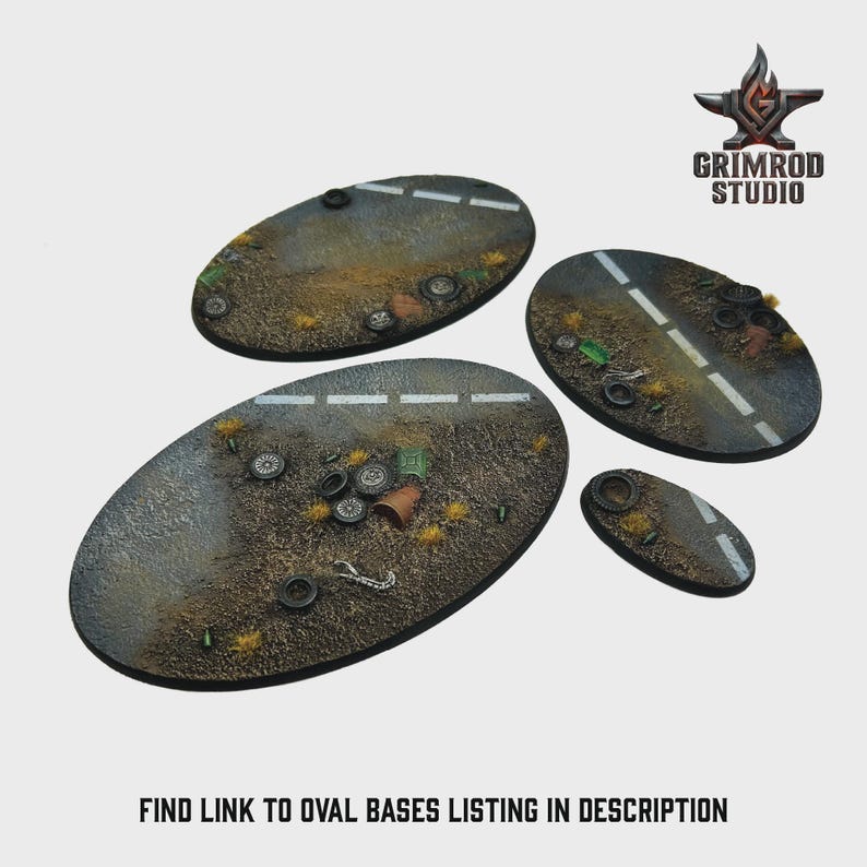 May include: Four oval-shaped miniature bases with a road design, featuring white dashed lines and scattered debris like tires and trash. The bases are in varying sizes and are designed for tabletop gaming. The Grimrod Studio logo is in the upper right corner. Text at the bottom reads: FIND LINK TO OVAL BASES LISTING IN DESCRIPTION.
