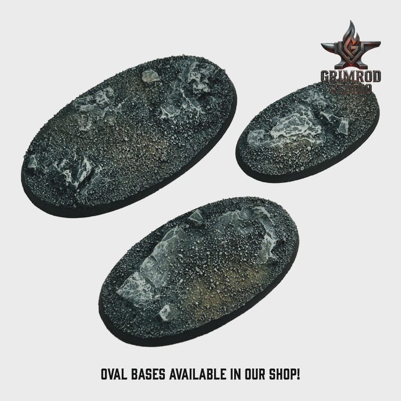 May include: Three oval-shaped bases with textured, rocky surfaces. The bases are dark gray with lighter gray and tan accents, and are of varying sizes. The Grimrod logo is in the upper right corner, and the text "OVAL BASES AVAILABLE IN OUR SHOP!" is at the bottom.