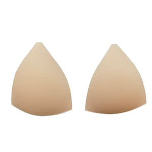 Puede incluir: Dos copas de sujetador triangulares de color beige hechas de espuma.