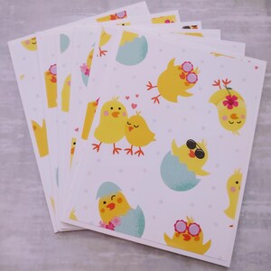 May include: A stack of six blank greeting cards with a repeating pattern of yellow chicks, some wearing sunglasses, and a chick hatching from an egg. The background is white with pink polka dots.