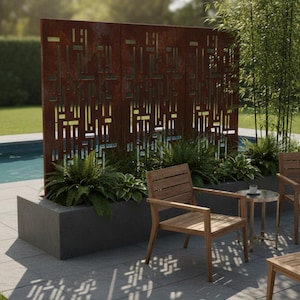 May include: Outdoor patio scene featuring a decorative metal screen with a geometric pattern, plants, and wooden chairs. The screen is a rusty brown color, and the chairs are made of light-colored wood. A small table with a glass top is also present.