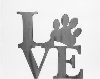 May include: Metal wall art in the shape of the word "LOVE" with a paw print replacing the "O".