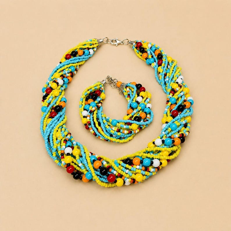 May include: A multi-strand beaded necklace and matching bracelet set featuring twisted strands of small glass beads in vibrant yellow, turquoise, white, black, red, and orange colors, secured with silver-toned metal lobster claw clasps.