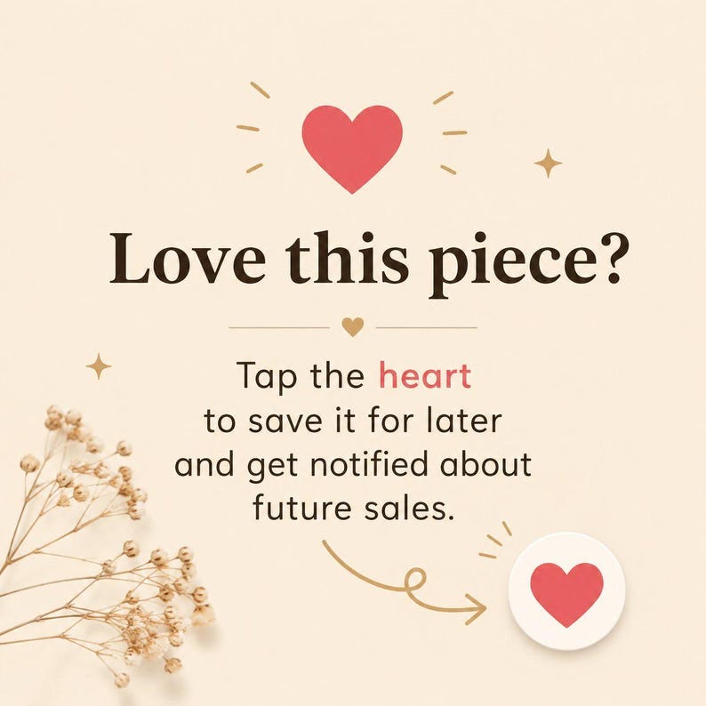 May include: A cream-colored graphic with a red heart icon and the text Love this piece? Tap the heart to save it for later and get notified about future sales. A small sprig of dried white flowers is visible in the lower left corner of the image.