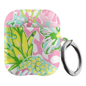 May include: A pink, white, green, and blue floral patterned Airpods case with a silver metal ring attached.