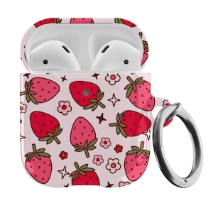 May include: A white Airpods case with a pink and red strawberry pattern and a silver metal keychain loop.