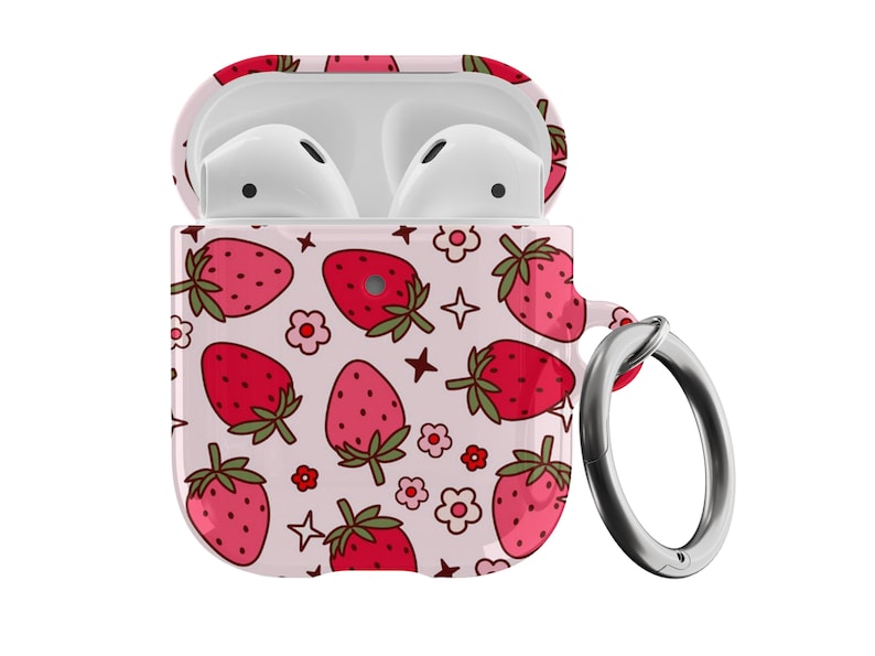 May include: A white Airpods case with a pink and red strawberry pattern and a silver metal keychain loop.