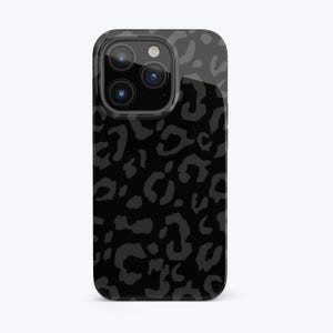 May include: Black phone case with a leopard print design.